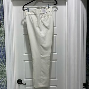 Cream, lined wool trousers. Ankle, with sit and side slit pockets.